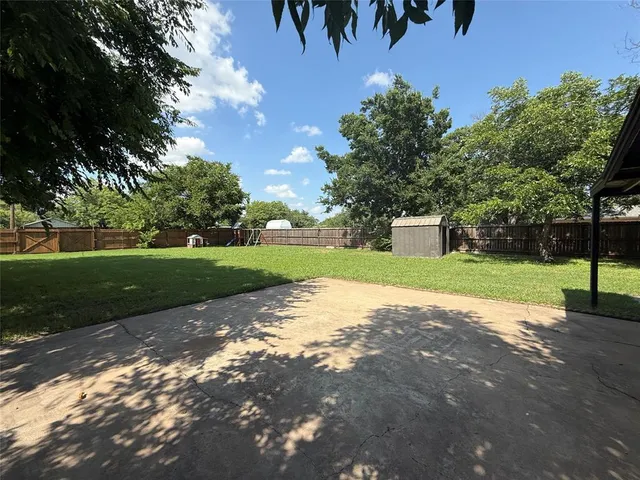 a view of a house with a big yard