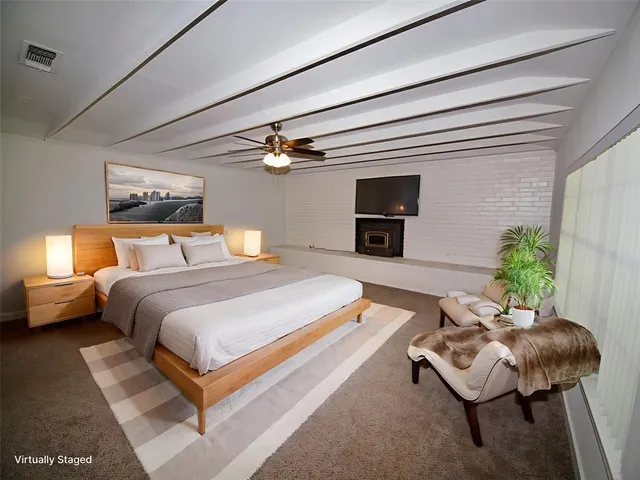 a bedroom with bed and chair