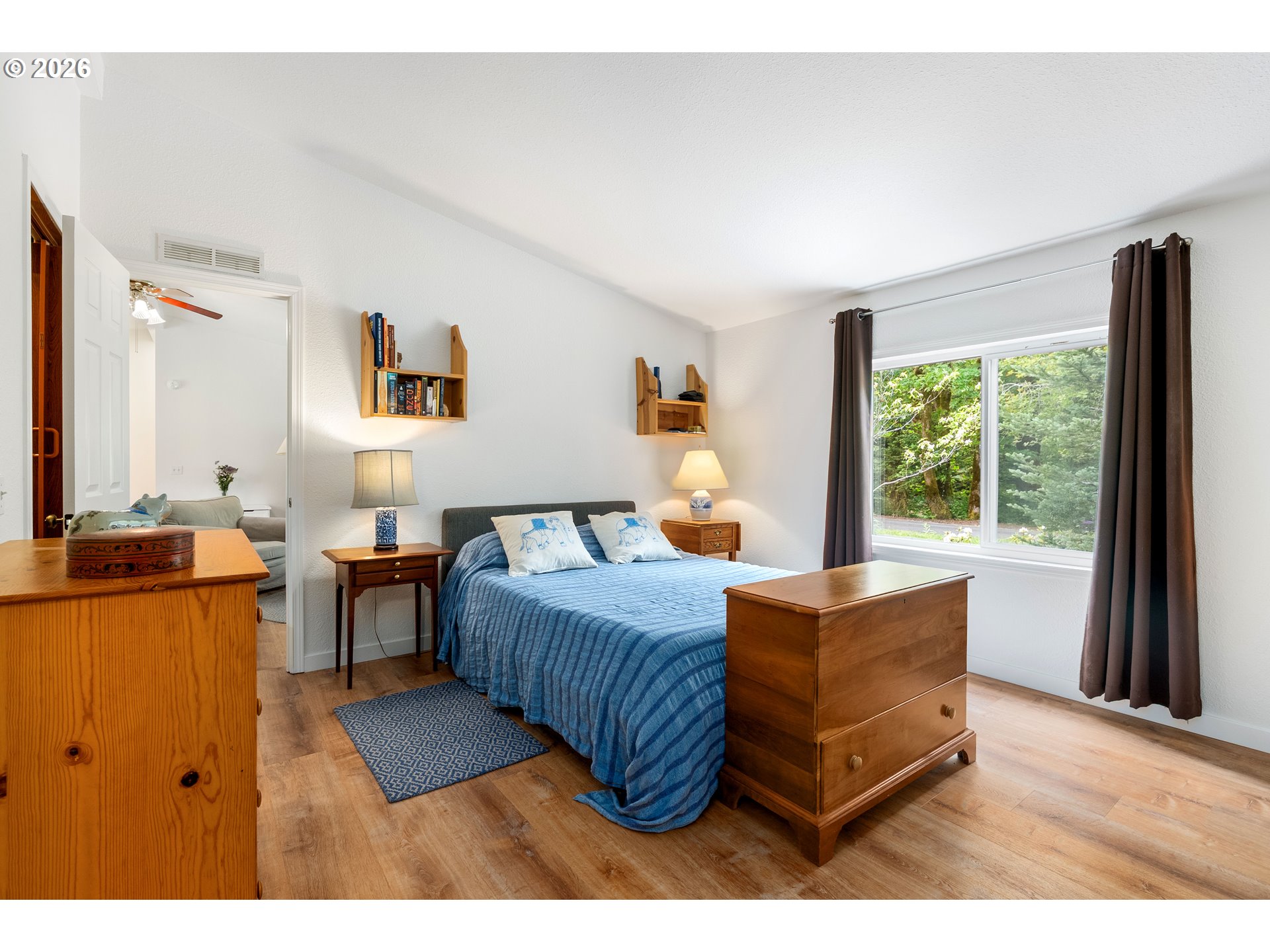 451 Cannavinna Road Carson, WA 98610 - Photo 16 of 33 a bedroom with furniture and a large window