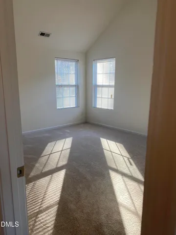 a view of hallway with windows
