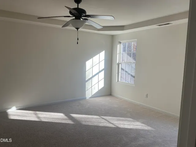 a view of empty room with windows