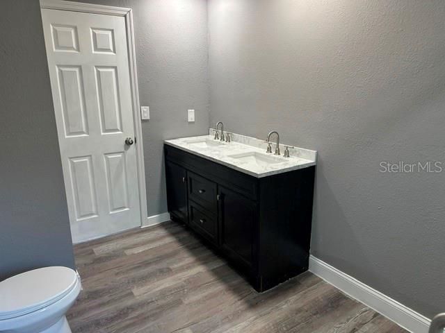 4520 North Hiawassee Road Orlando, FL 32818 - Photo 17 of 19 a kitchen with a sink vanity and a toilet