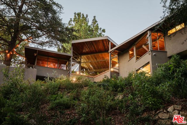 an outdoor space with seating and trees
