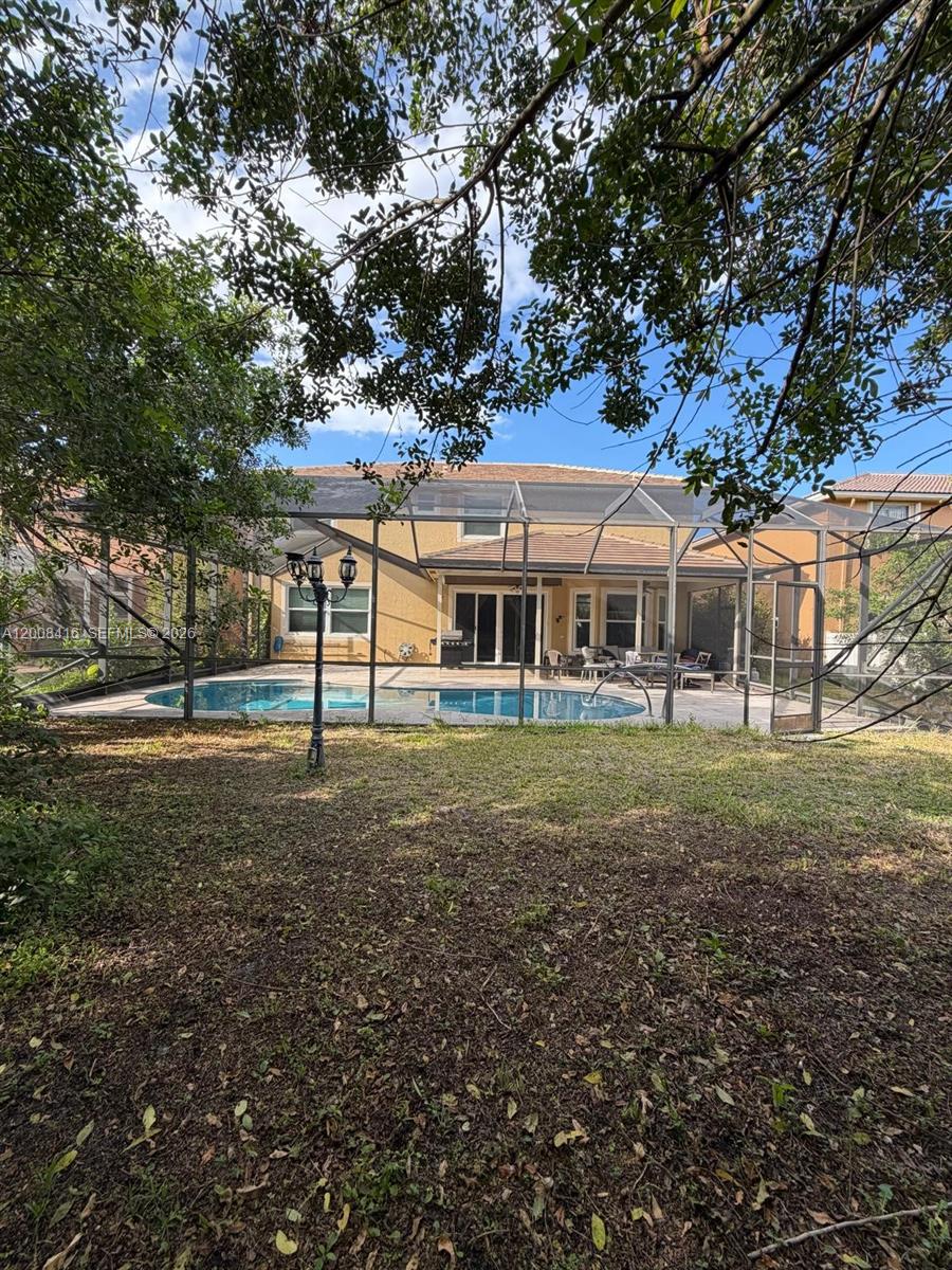 12680 Little Palm Lane Boca Raton, FL 33428 - Photo 13 of 13 a front view of a house with a yard