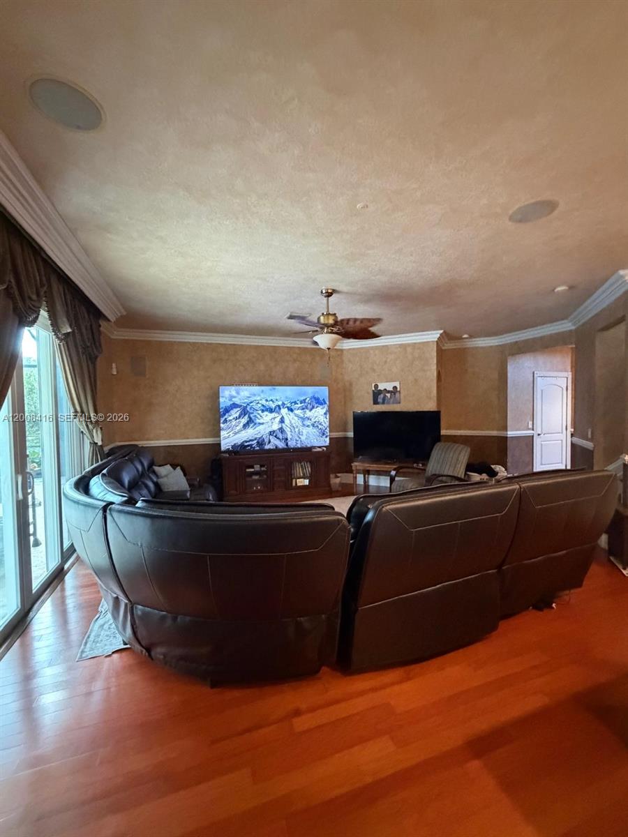 12680 Little Palm Lane Boca Raton, FL 33428 - Photo 4 of 13 a living room with furniture and a flat screen tv