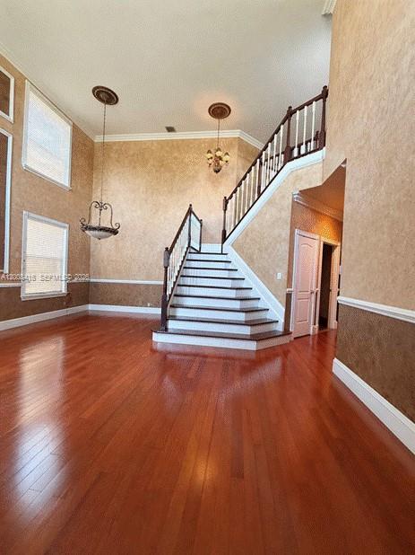 12680 Little Palm Lane Boca Raton, FL 33428 - Photo 5 of 13 a view of entryway and hall with wooden floor
