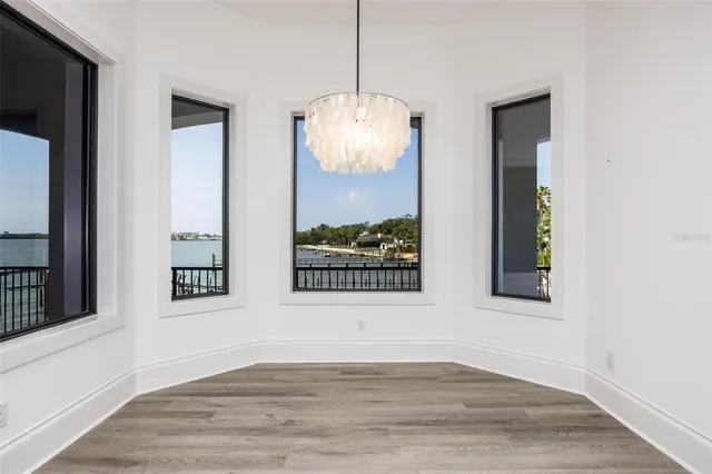 an empty room with wooden floor