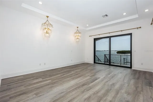 a bathroom with a granite countertop sink mirror and toilet