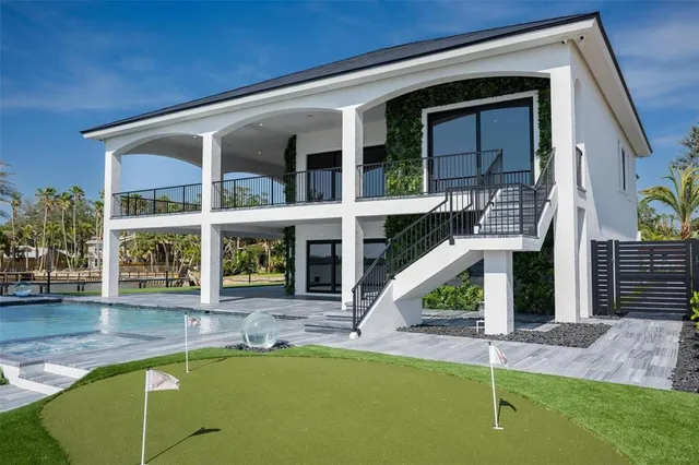 a view of swimming pool with outdoor seating
