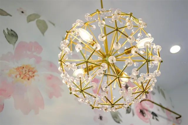 a view of a swimming pool with a table and chairs