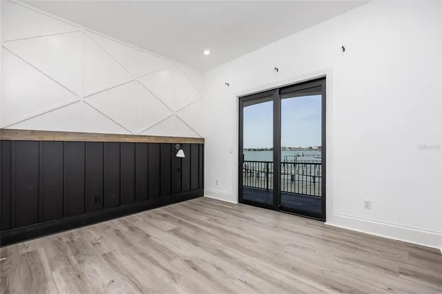 a view of balcony with furniture and wooden floor