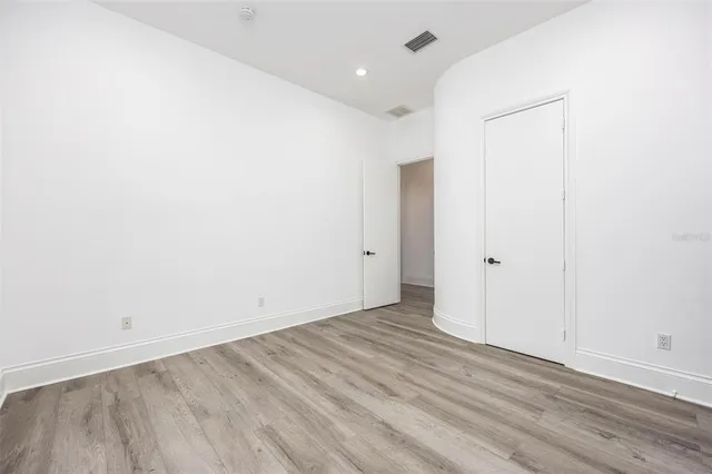a view of a balcony with wooden floor