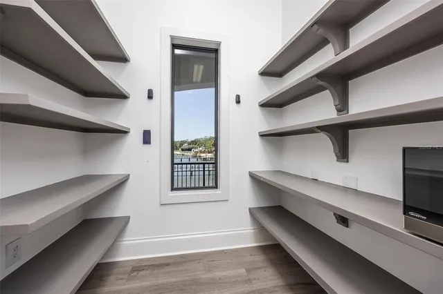 an aerial view of a house with swimming pool and porch