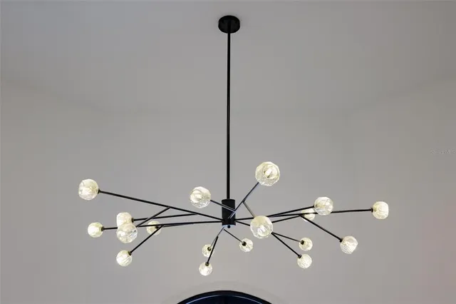 a front view of a house with outdoor seating and trees