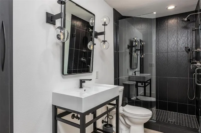 an aerial view of a house with swimming pool and a yard