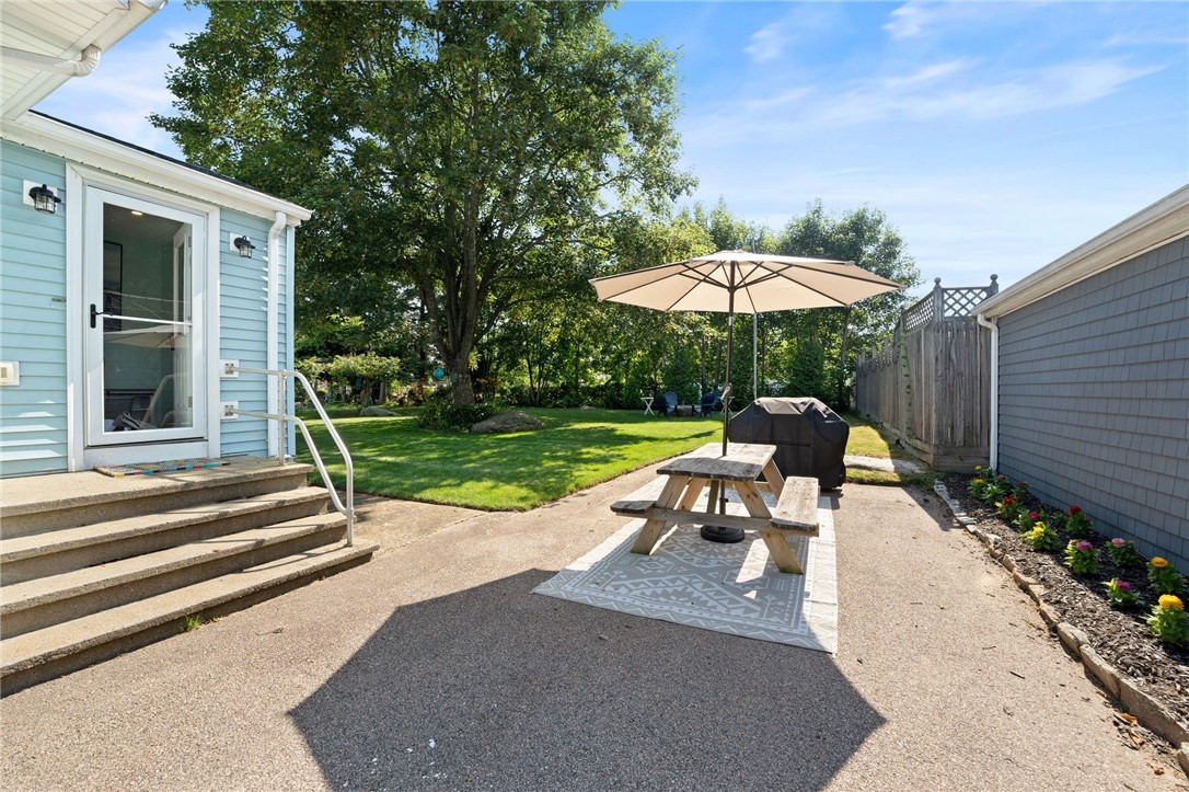 9 Woodlund Avenue Westerly, RI 02891 - Photo 32 of 47 Outdoor dining and umbrella complete with a grill