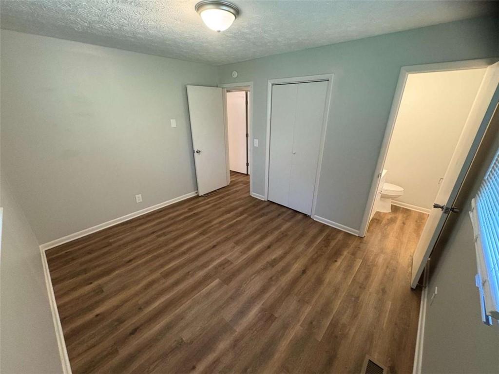 511 East Marable Street Monroe, GA 30656 - Photo 11 of 15 a view of room with window and hardwood floor