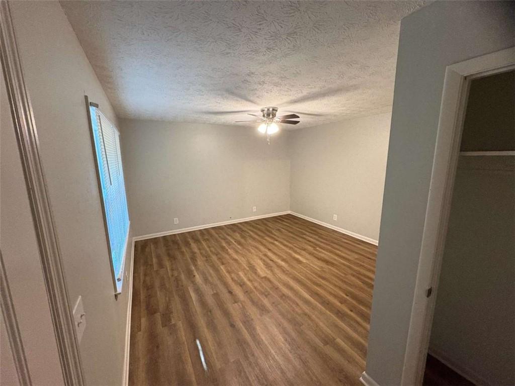 511 East Marable Street Monroe, GA 30656 - Photo 2 of 15 a view of a room with wooden floor