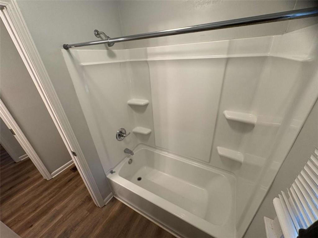 511 East Marable Street Monroe, GA 30656 - Photo 6 of 15 a bathroom with a tub