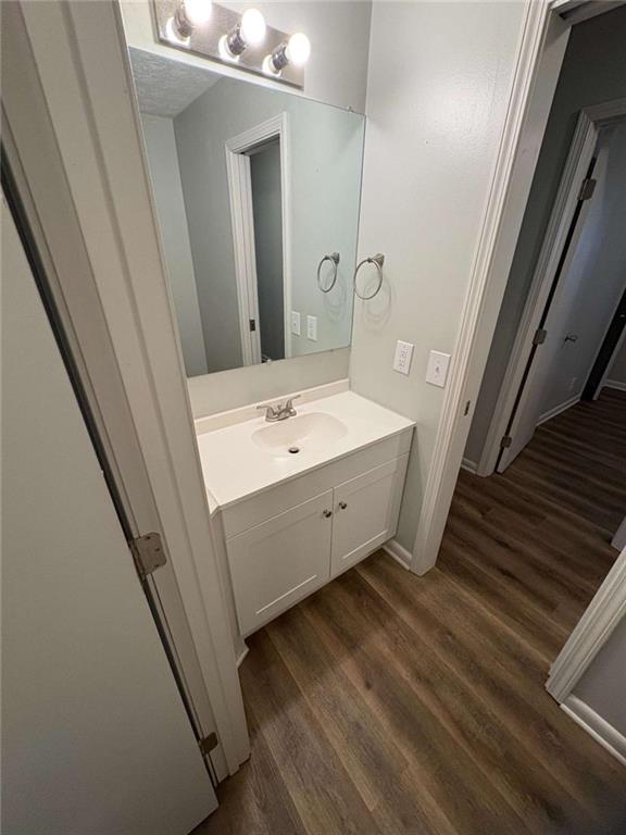 511 East Marable Street Monroe, GA 30656 - Photo 8 of 15 a bathroom with a sink a mirror and vanity