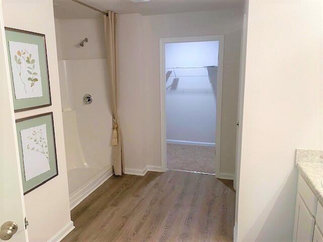 557 Mary Lou Way Crestview, FL 32539 - Photo 12 of 29 a view of a hallway with wooden floor and closet