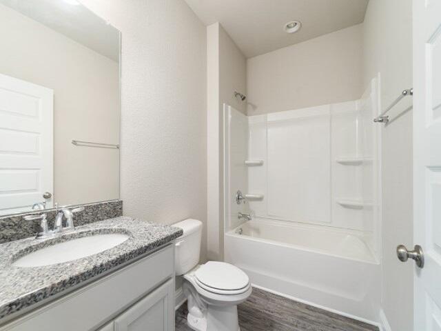 557 Mary Lou Way Crestview, FL 32539 - Photo 15 of 29 a bathroom with a granite countertop sink toilet and shower