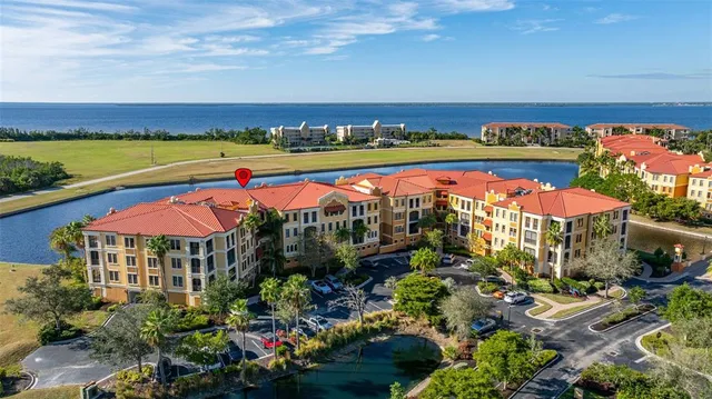 an aerial view of residential houses with outdoor space and street view