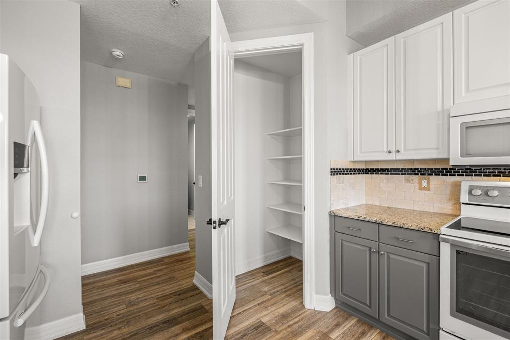 99 Vivante Boulevard, Unit 305/9935 Punta Gorda, FL 33950 - Photo 17 of 73 a kitchen with a sink and cabinets