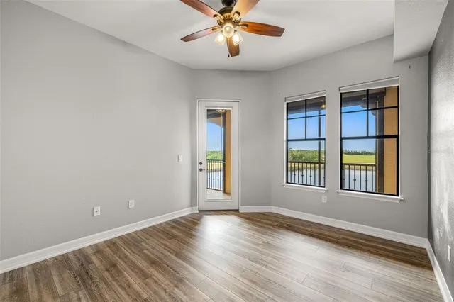 a view of an empty room with a window