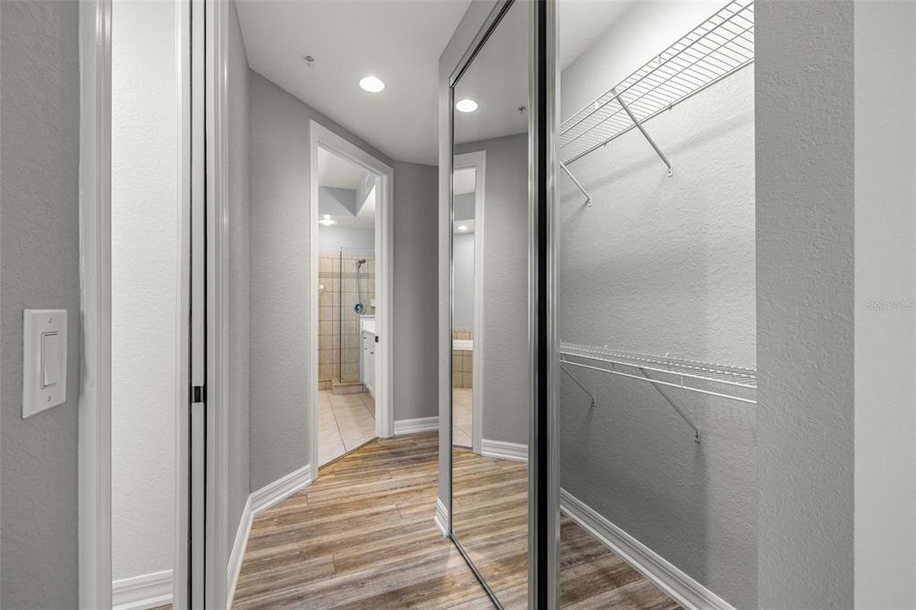 99 Vivante Boulevard, Unit 305/9935 Punta Gorda, FL 33950 - Photo 23 of 73 a view of a hallway with wooden floor and staircase