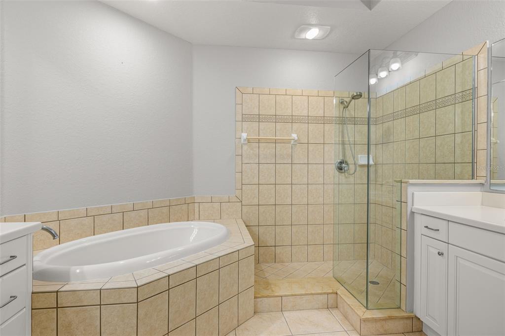 99 Vivante Boulevard, Unit 305/9935 Punta Gorda, FL 33950 - Photo 27 of 73 a bathroom with a bathtub and shower