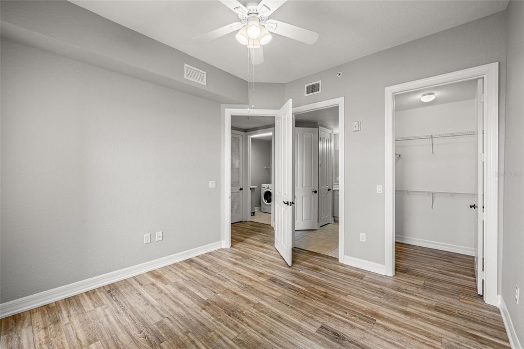 99 Vivante Boulevard, Unit 305/9935 Punta Gorda, FL 33950 - Photo 32 of 73 wooden floor in an empty room with a window
