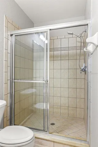 a view of swimming pool with outdoor seating and yard in back