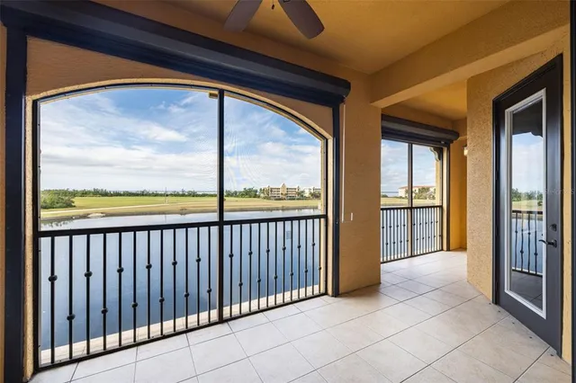 a view of a yard in front of a house with a large tree