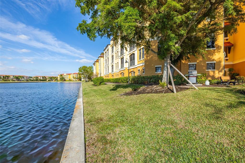 99 Vivante Boulevard, Unit 305/9935 Punta Gorda, FL 33950 - Photo 42 of 73 a view of a house with a yard