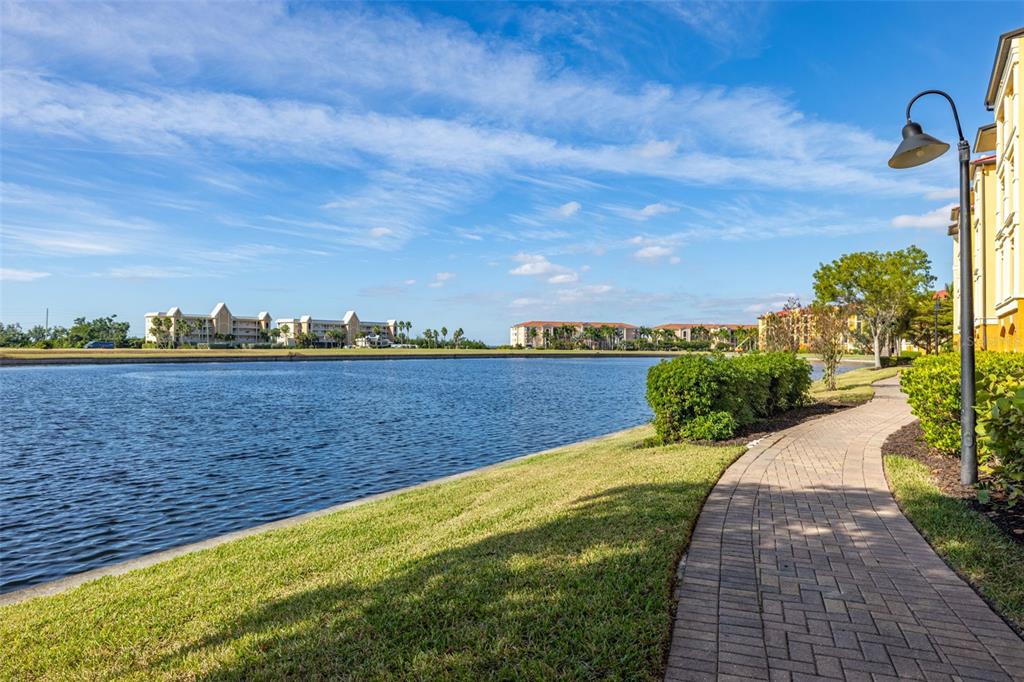 99 Vivante Boulevard, Unit 305/9935 Punta Gorda, FL 33950 - Photo 43 of 73 a view of swimming pool with outdoor seating and yard in back