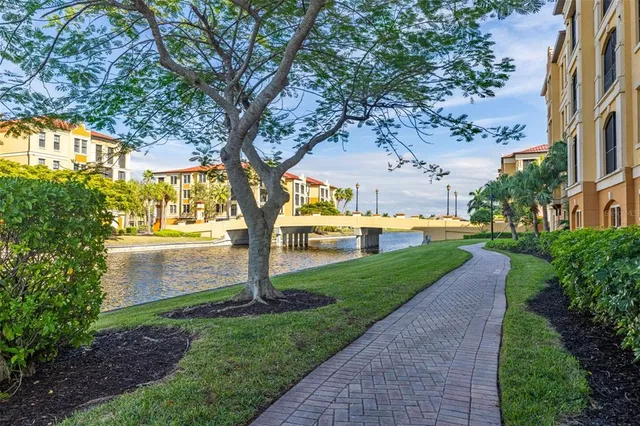 a room with pool table and windows