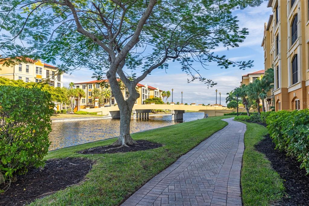 99 Vivante Boulevard, Unit 305/9935 Punta Gorda, FL 33950 - Photo 46 of 73 a view of a yard in front of a house with a large tree