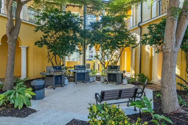 an aerial view of a house with a garden and lake view