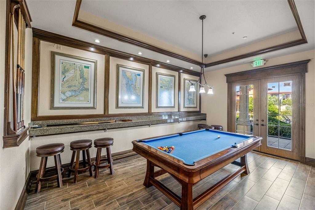 99 Vivante Boulevard, Unit 305/9935 Punta Gorda, FL 33950 - Photo 57 of 73 a room with pool table and windows