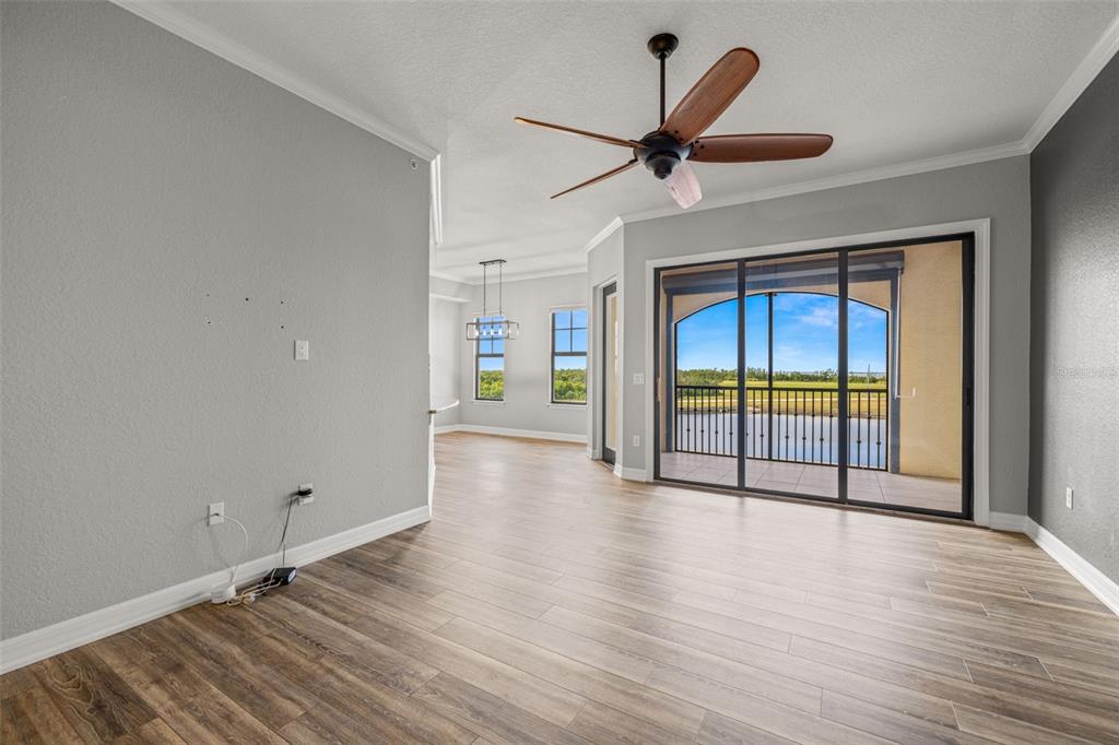 99 Vivante Boulevard, Unit 305/9935 Punta Gorda, FL 33950 - Photo 7 of 73 wooden floor in an empty room with a window