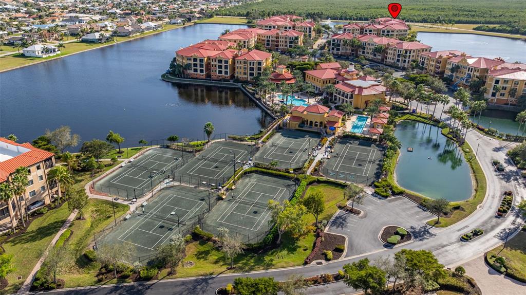 99 Vivante Boulevard, Unit 305/9935 Punta Gorda, FL 33950 - Photo 73 of 73 an aerial view of a house with a swimming pool patio and outdoor seating