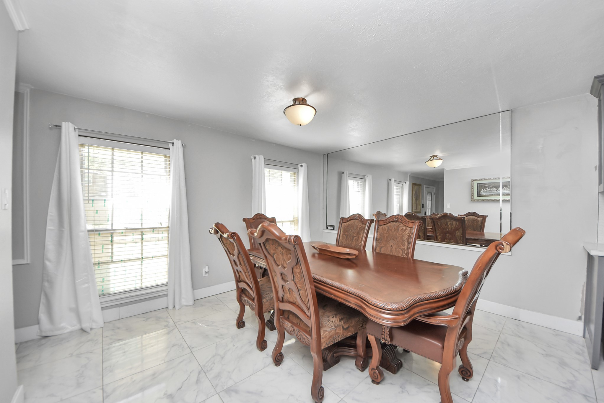 1011 Whitestone Lane Houston, TX 77073 - Photo 30 of 48 a view of a dining room with furniture and a floor to ceiling window