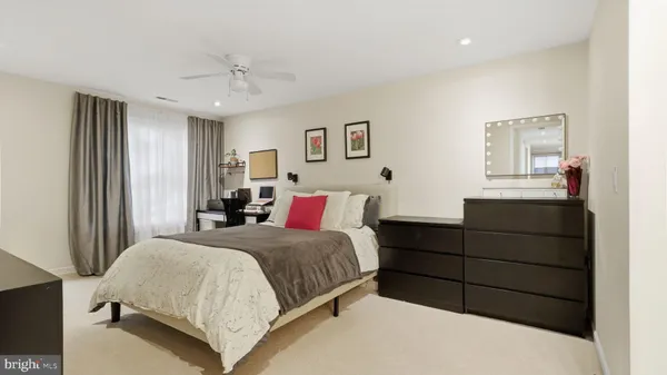 a bedroom with a bed and a dresser