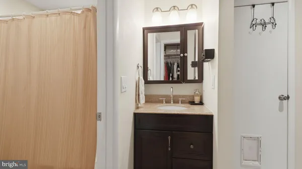 a bathroom with a double vanity sink and a mirror