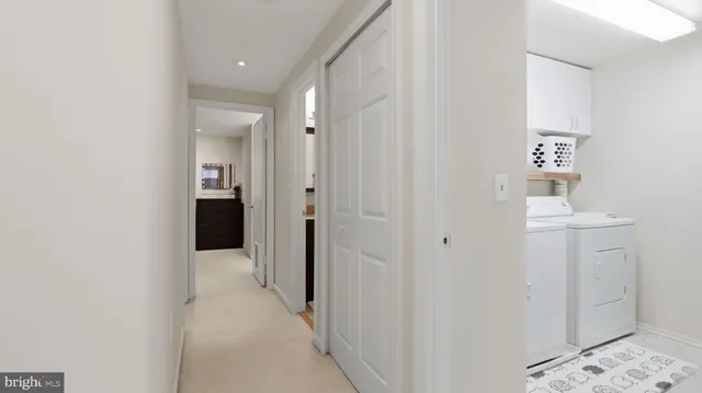 a view of a hallway with some storage and utility room