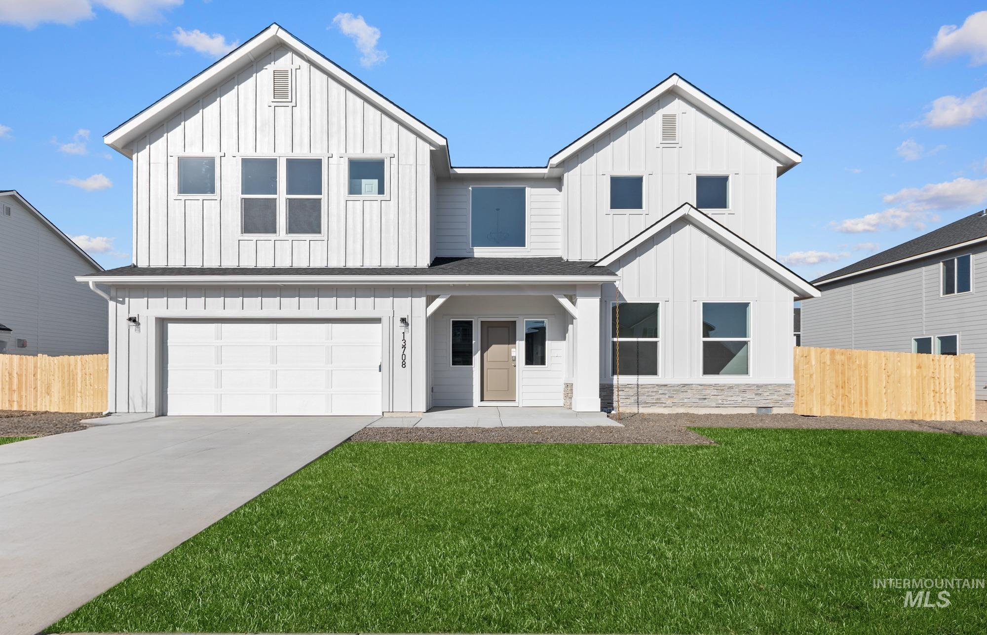 13708 Judson Street Caldwell, ID 83607 - Photo 1 of 29 Modern inspired farmhouse featuring board and batten siding, an attached garage, and covered porch