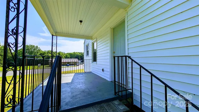 a view of a balcony with staircase