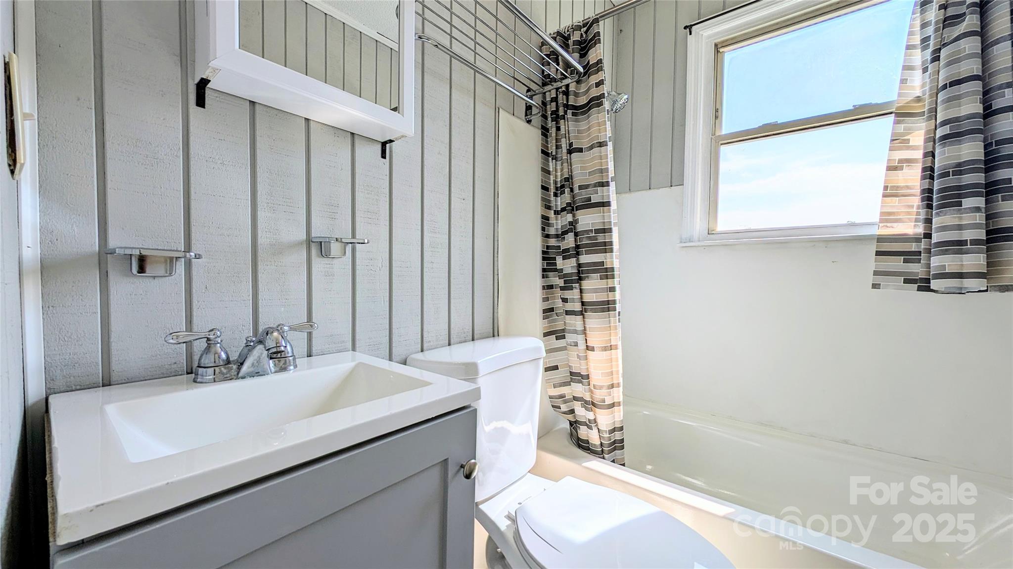 556 6th Street Chester, SC 29706 - Photo 6 of 17 a bathroom with a sink a toilet and shower