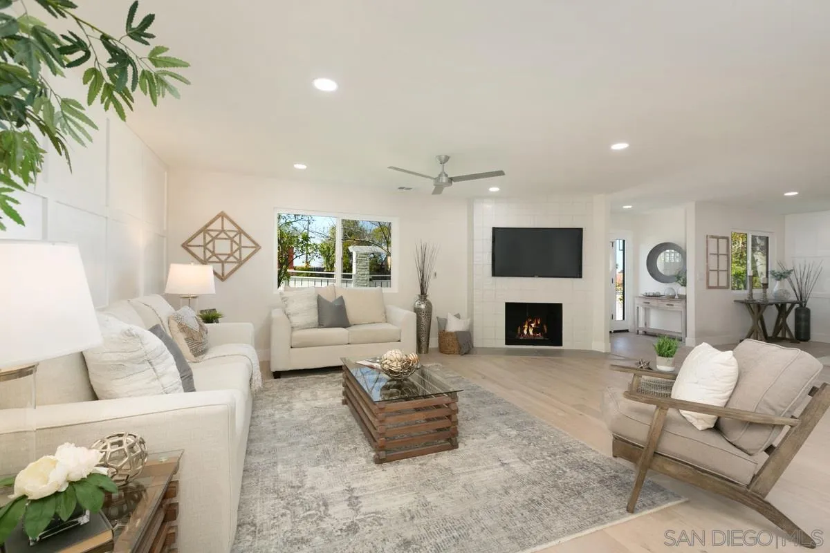 853 Regal Road Encinitas, CA 92024 - Photo 11 of 34 a living room with furniture fireplace and flat screen tv